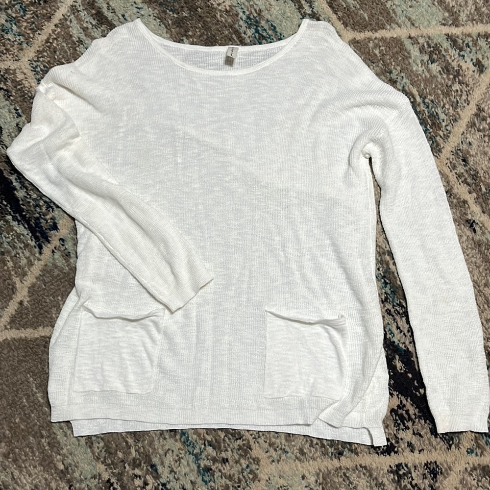 This is a lightweight long sleeve sweater size large never worn.